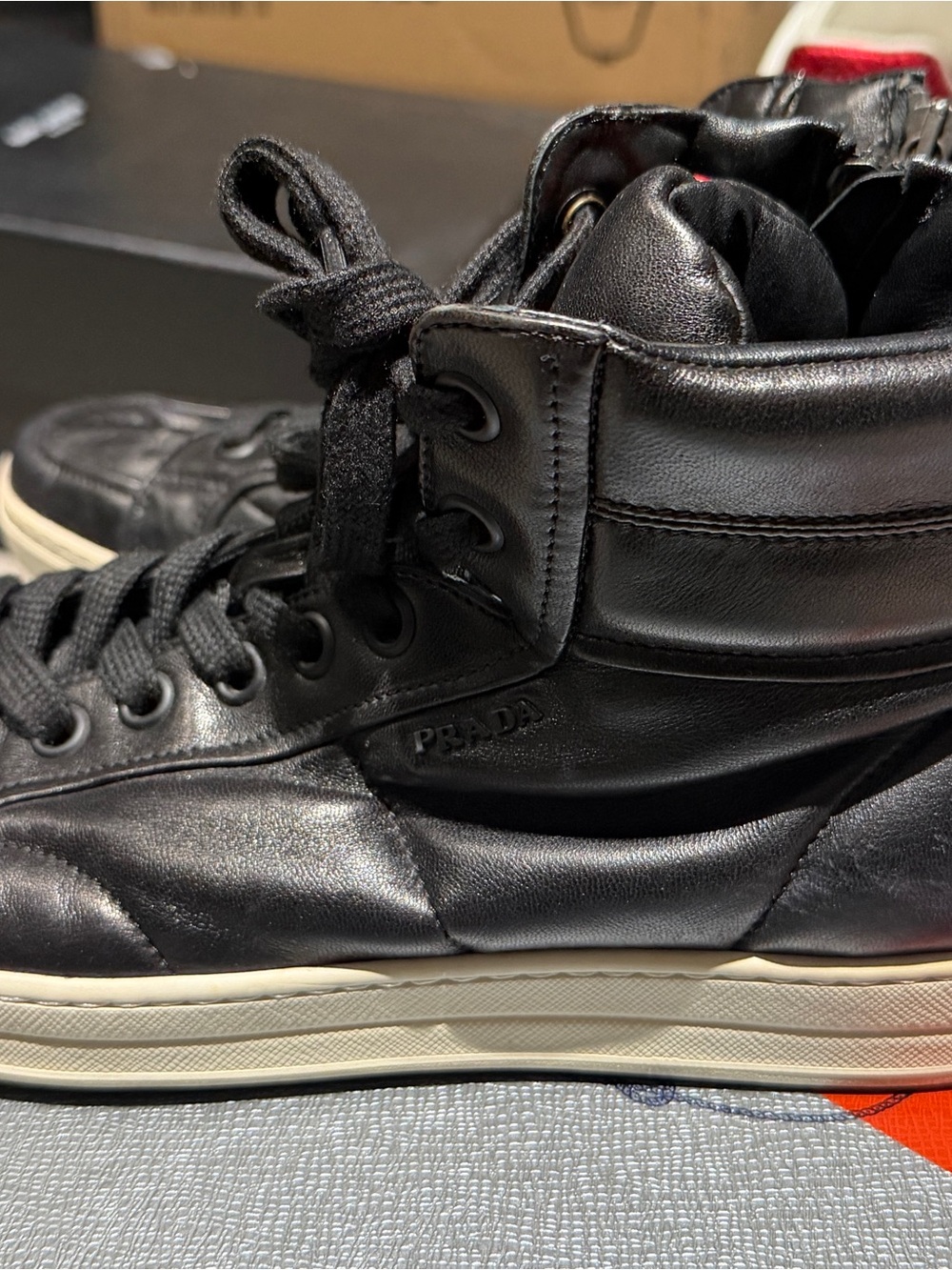 Prada Black Leather High-Top Sneakers with Red Logo Stripe - Picture 2 of 5